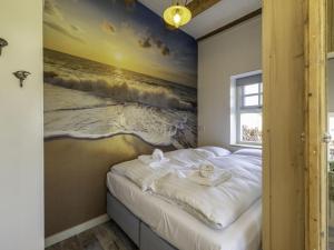 En eller flere senge i et værelse på Apartment Charming house Koudekerke by Interhome + 22 billeder