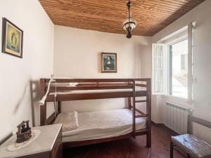 Ένα ή περισσότερα κρεβάτια σε δωμάτιο στο Holiday Home Gionni by Interhome