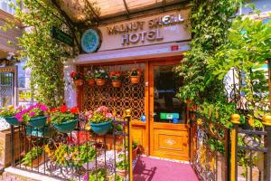 a flower shop with potted plants in front of it at Walnut Shell Hotel in Istanbul