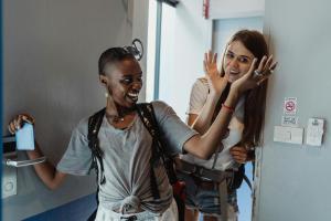 two women are standing in a hospital room at Mustard Hostel in Dijon