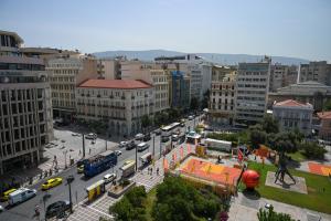 an overhead view of a city with a busy street at Hermes Suite Klathmonos by Zeussuites in Athens
