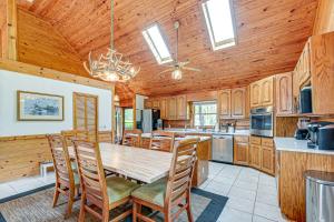 a kitchen with a table and chairs in a room at Hyco Lake Escape with Deck and Dock Families Welcome! in Semora