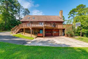 a large wooden house with a basketball hoop at Hyco Lake Escape with Deck and Dock Families Welcome! in Semora