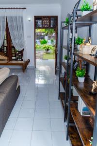 a living room with a couch and a table at Serenity Villa in Madurugomuwa