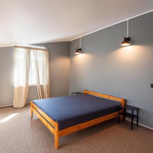 Ένα ή περισσότερα κρεβάτια σε δωμάτιο στο Objekts Guesthouse - Creative Quarter Apartment