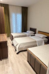 Ένα ή περισσότερα κρεβάτια σε δωμάτιο στο Emerald Luxury 2 Bedroom, 2 Bathroom Apartment +12 φωτογραφίες