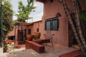 a house with a toilet on the side of it at Casa Arrona Oaxaca in Oaxaca City