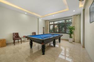 a living room with a pool table in it at Anh House 85 in Da Nang