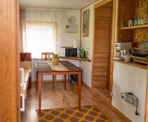 a small kitchen with a table and a kitchen with a counter at Kodavere puhkemaja 1 in Tartu