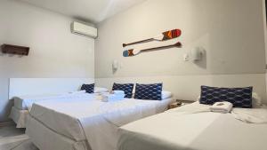 Una cama o camas en una habitación de Pousada Mar E Mata