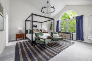 a bedroom with a canopy bed and a table and chairs at Best Deal In The Poconos! in Pocono Country Place