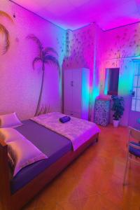 a bedroom with a bed with a pink ceiling at H2T Home in Ho Chi Minh City