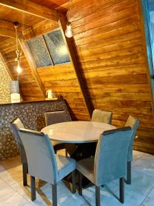 a dining room with a table and chairs at Chalé da Serra in Araruna
