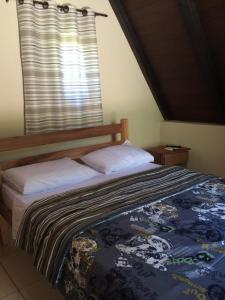 Cama ou camas em um quarto em Pousada Ecologica Bangalo de Praia