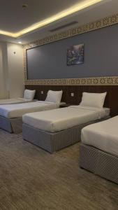 Ένα ή περισσότερα κρεβάτια σε δωμάτιο στο المشاعر