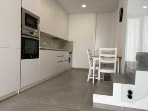 Kuchyň nebo kuchyňský kout v ubytování playa honda airport suite + 15 fotografií