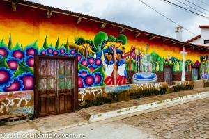 a building with a colorful mural on the side of it at Ana's Place in Santa Ana