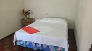 a small bed in a corner of a room at Ana's Place in Santa Ana +5 photos