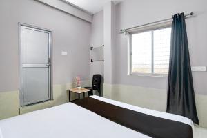 Ένα ή περισσότερα κρεβάτια σε δωμάτιο στο HOTEL O TRINAY +20 φωτογραφίες