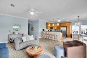 a living room with a couch and a table at Navigate Stays Florida Keys Home with Private Dock in Crawl Key Number Two