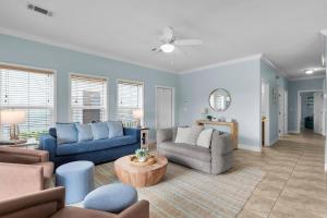 a living room with two couches and a table at Navigate Stays Florida Keys Home with Private Dock in Crawl Key Number Two