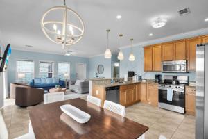 a kitchen and living room with a table and chairs at Navigate Stays Florida Keys Home with Private Dock in Crawl Key Number Two +31 photos