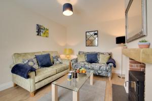 Et opholdsområde på Holly Tree Cottage