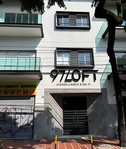 a building with a sign for a hotel at 303 Espectacular Apartamento en granada in Cali +16 photos