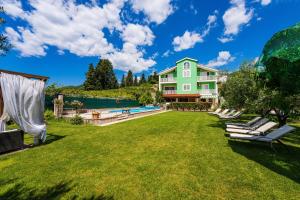 a yard with a pool and a house at MY DALMATIA - Villa Green Paradise with private heated swimming pool in Peračko Blato +100 photos