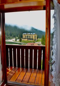 a balcony with a view of a large building at Balcone sulle Tre Cime di Lavaredo in Misurina