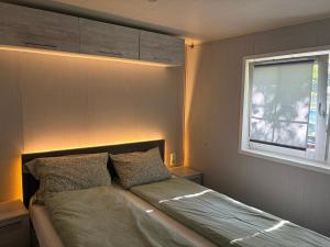 Ένα ή περισσότερα κρεβάτια σε δωμάτιο στο Korzkiewka