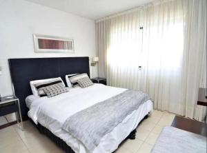 Ένα ή περισσότερα κρεβάτια σε δωμάτιο στο Montefusco hospedaje villa gesell