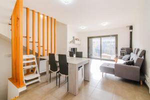 a living room with a table and a couch at La Caseta de Cercs, Barbecue y Pet Friendly in Sant Jordi de Cercs