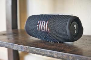 a black speaker sitting on top of a table at The Emerald Apartments Ibex Meanwood in Lusaka