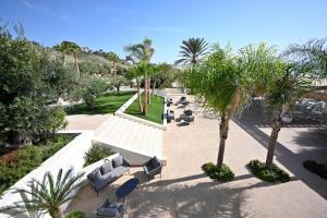 an overhead view of a park with couches and palm trees at Ristorante Hotel DA VITTORIO in Menfi +21 photos
