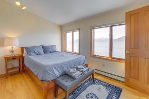 a bedroom with a bed and a window at 9 Mi to Mendenhall Glacier Waterfront Juneau Home in Juneau International Airport