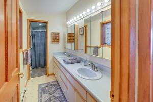 a bathroom with a sink and a mirror at 9 Mi to Mendenhall Glacier Waterfront Juneau Home in Juneau International Airport +29 photos
