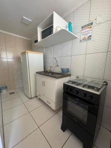 Kuchyň nebo kuchyňský kout v ubytování Flat Diroma Internacional Resort + 10 fotografií