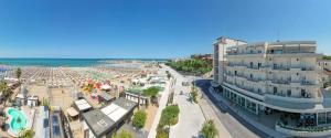 an aerial view of a beach with a building at Hotel Bellevue in Cattolica