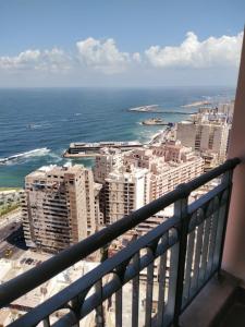 a view of the ocean from the balcony of a building at Luxury Sea View Apartment in Four Seasons Alexandria in Alexandria