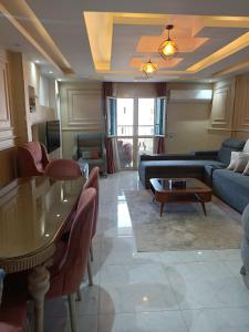 a living room with a couch and a table at اكتوبر الحصري 6 October in 6th Of October