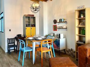 a dining room with a table and chairs at Suitable unique design with natural light Envigado in Envigado