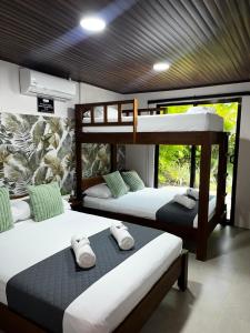 a room with two bunk beds in it at Casa Hachi in Talamanca
