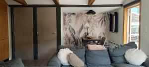 a living room with a couch and a table at Ardennen Le Chalet Castor - Bomal - Durbuy in Bomal