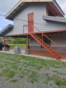a house with a staircase on the side of it at Quinta El Futuro in Esperanza