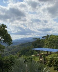 a picnic table with a view of the mountains at Hotel Campestre Morichal in Tauramena +22 photos