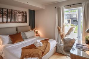 Ένα ή περισσότερα κρεβάτια σε δωμάτιο στο Luxe Alpine MSA - Ski Spa et Confort +97 φωτογραφίες