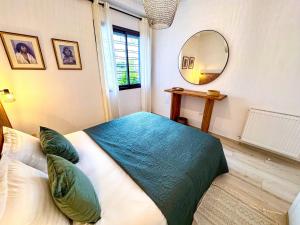 Ένα ή περισσότερα κρεβάτια σε δωμάτιο στο Cocon douceur