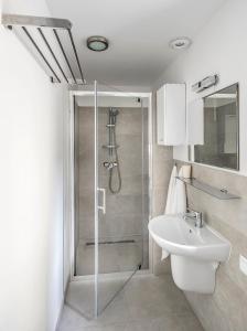 a bathroom with a shower and a sink at Green House - Two Bedroom Apartment in Bielsko-Biała