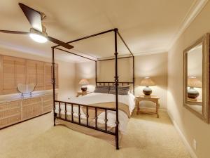 a bedroom with a bed and a ceiling fan at Solana Oceanfront with Pool, Spa, Ocean Views in Solana Beach +29 photos